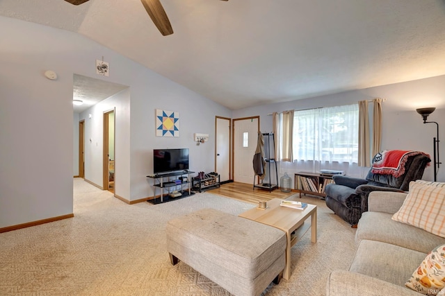 3502 S Tyler Ln, Bloomington, IN 47403 - living room featuring lofted ceiling, light colored carpet, a ceiling fan, and baseboards