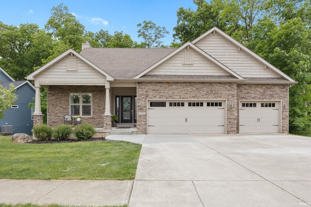 6203 Munsee Dr, West Lafayette, IN 47906 - craftsman inspired home with a garage, driveway, a front yard, a chimney, and a shingled roof