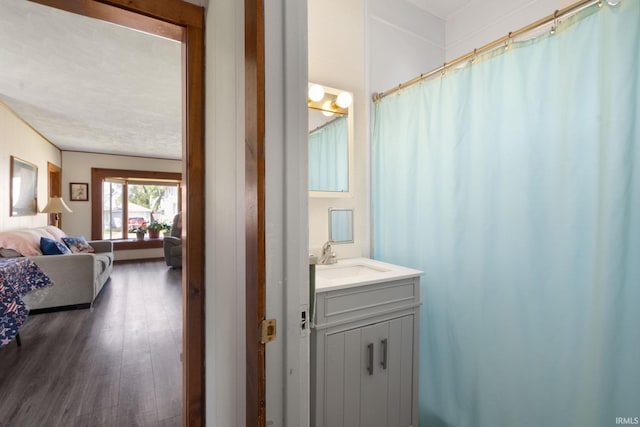 913 Cedar St, Elkhart, IN 46514 - bathroom featuring vanity, ensuite bath, and wood finished floors