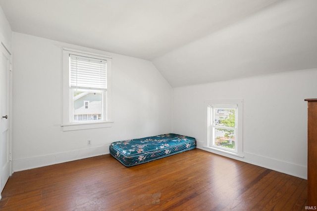 913 Cedar St, Elkhart, IN 46514 - bedroom featuring hardwood / wood-style floors, vaulted ceiling, and baseboards