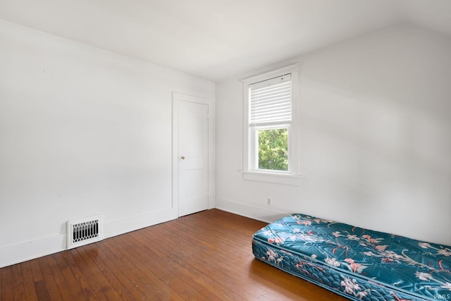 913 Cedar St, Elkhart, IN 46514 - bedroom featuring wood-type flooring, baseboards, and vaulted ceiling