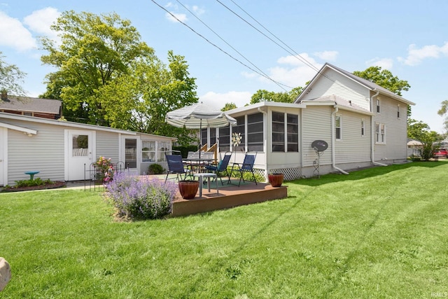 913 Cedar St, Elkhart, IN 46514 - rear view of house with a sunroom and a yard