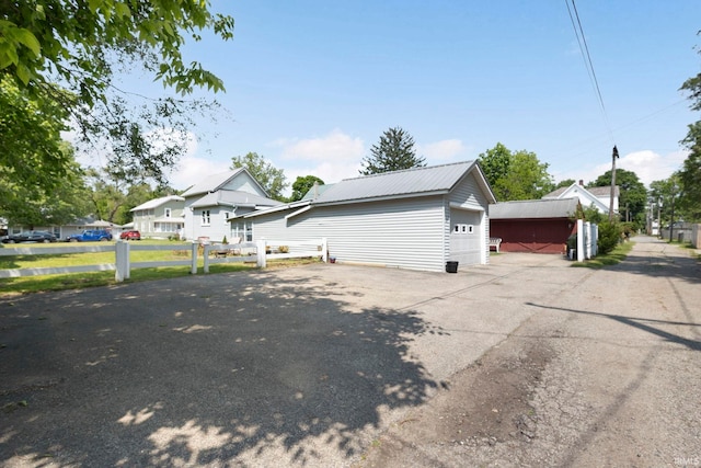 913 Cedar St, Elkhart, IN 46514 - view of side of property with a detached garage and metal roof