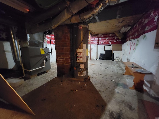 257 Center St, Auburn, IN 46706 - unfinished basement featuring gas water heater and heating unit