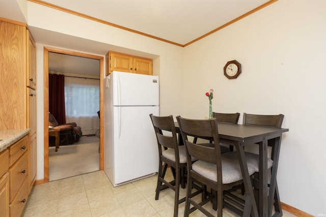 2524 Milburn Blvd, Mishawaka, IN 46544 - dining room with ornamental molding and light floors