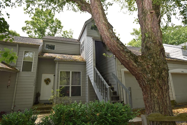1942 E Bay Pointe Dr, Bloomington, IN 47401 - view of front of house featuring stairs and an attached garage