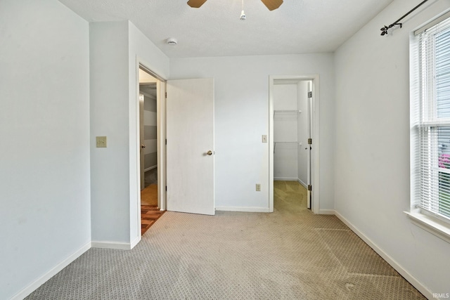 1888 Halyard Ct, West Lafayette, IN 47906 - unfurnished bedroom featuring light carpet, multiple windows, a spacious closet, and baseboards