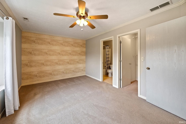 1888 Halyard Ct, West Lafayette, IN 47906 - unfurnished room with wood walls, a ceiling fan, carpet flooring, crown molding, and baseboards