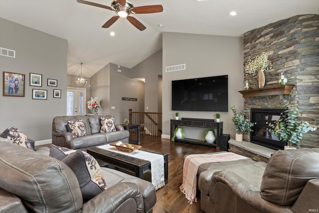 7503 Toscana Ct, Granger, IN 46530 - living room with wood finished floors, a ceiling fan, baseboards, high vaulted ceiling, and a stone fireplace