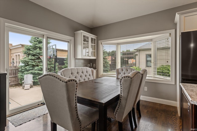 7503 Toscana Ct, Granger, IN 46530 - dining space with baseboards and dark wood-type flooring