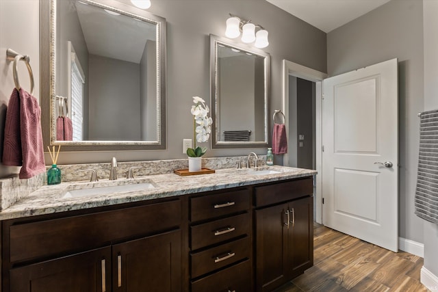 7503 Toscana Ct, Granger, IN 46530 - bathroom with double vanity and wood finished floors