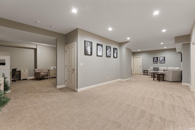 7503 Toscana Ct, Granger, IN 46530 - living area featuring light colored carpet, a desk, baseboards, and recessed lighting
