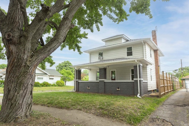 1002 S 33rd St, South Bend, IN 46615 - american foursquare style home featuring a chimney, a porch, and brick siding