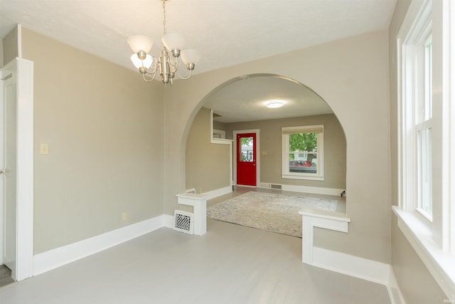 1002 S 33rd St, South Bend, IN 46615 - entrance foyer featuring arched walkways, a chandelier, and baseboards
