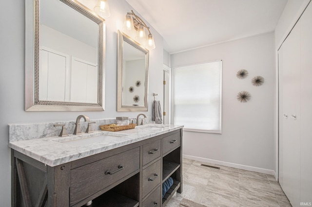 15711 Durham Way, Granger, IN 46530 - bathroom with double vanity and baseboards