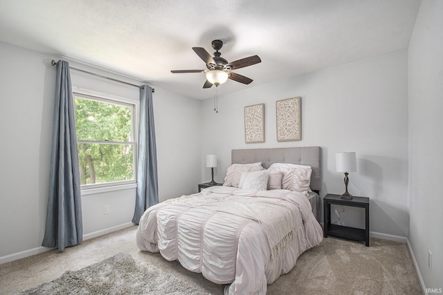 15711 Durham Way, Granger, IN 46530 - bedroom featuring light carpet, baseboards, and a ceiling fan