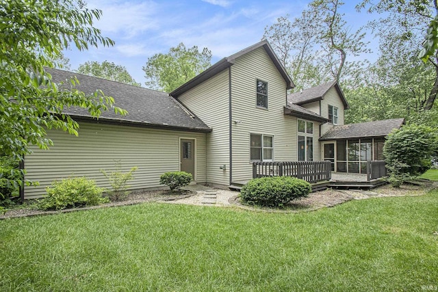 15711 Durham Way, Granger, IN 46530 - rear view of house featuring a sunroom, a deck, a shingled roof, and a lawn