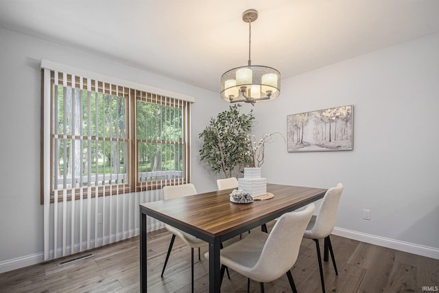 15711 Durham Way, Granger, IN 46530 - dining room featuring a chandelier, wood finished floors, and baseboards