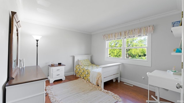 1229 Dell Cove Dr, Fort Wayne, IN 46804 - bedroom with wood finished floors, crown molding, and baseboards