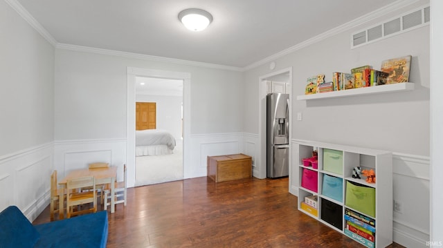 1229 Dell Cove Dr, Fort Wayne, IN 46804 - playroom featuring ornamental molding, a wainscoted wall, and dark wood-style flooring
