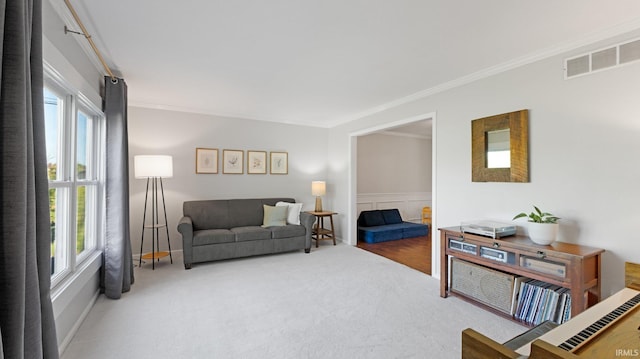 1229 Dell Cove Dr, Fort Wayne, IN 46804 - carpeted living room with ornamental molding and wainscoting