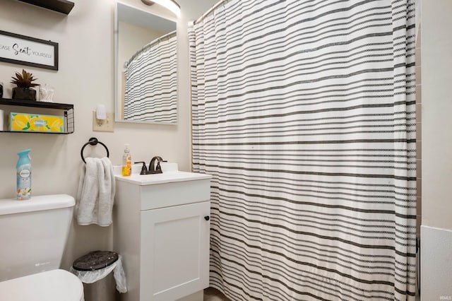 2408 W Sheffield Dr, Muncie, IN 47304 - bathroom featuring toilet, vanity, and curtained shower