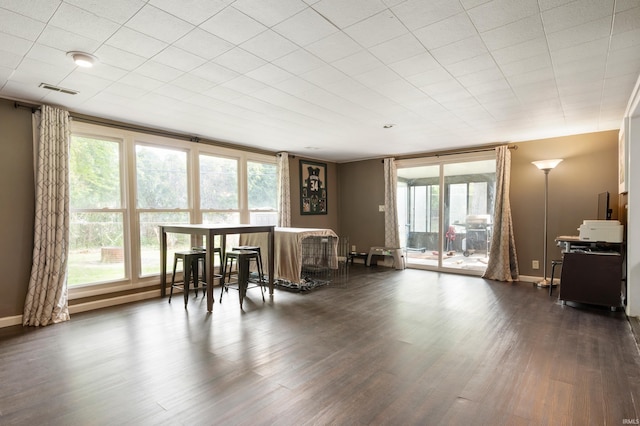 2408 W Sheffield Dr, Muncie, IN 47304 - dining area featuring plenty of natural light, dark wood-style flooring, and baseboards