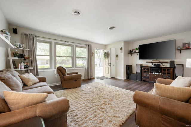 2408 W Sheffield Dr, Muncie, IN 47304 - living room featuring dark wood-style floors and baseboards