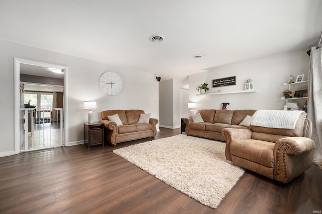 2408 W Sheffield Dr, Muncie, IN 47304 - living area with dark wood finished floors and baseboards