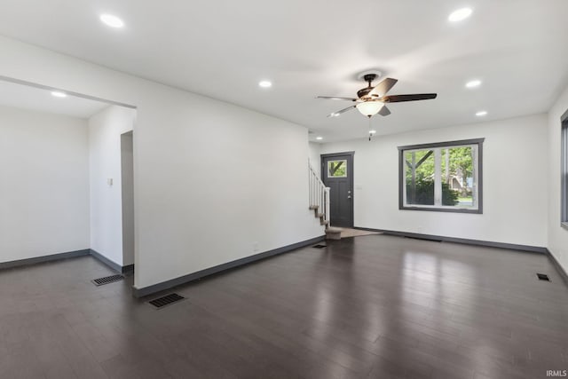6226 Wheeling Ave, Muncie, IN 47304 - unfurnished room with dark wood finished floors, recessed lighting, stairs, baseboards, and ceiling fan