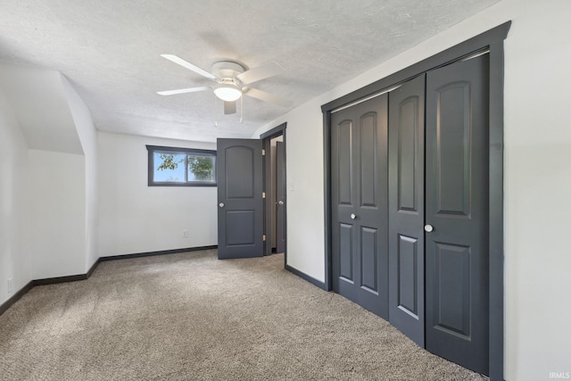 6226 Wheeling Ave, Muncie, IN 47304 - unfurnished bedroom featuring carpet flooring, a textured ceiling, baseboards, a closet, and ceiling fan