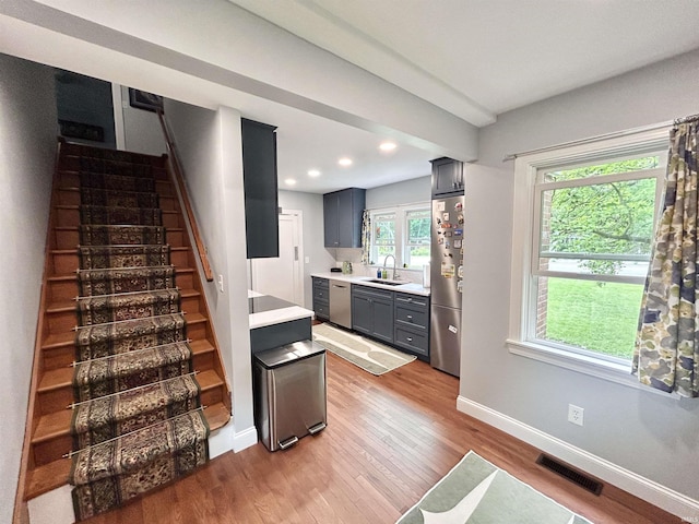 1500 N Grant St, West Lafayette, IN 47906 - stairs with wood finished floors, baseboards, and recessed lighting