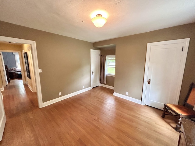 1500 N Grant St, West Lafayette, IN 47906 - unfurnished bedroom with light wood-style flooring and baseboards