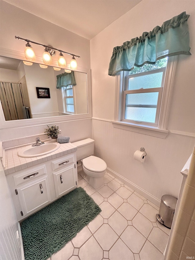 1500 N Grant St, West Lafayette, IN 47906 - bathroom with a wainscoted wall, toilet, and vanity