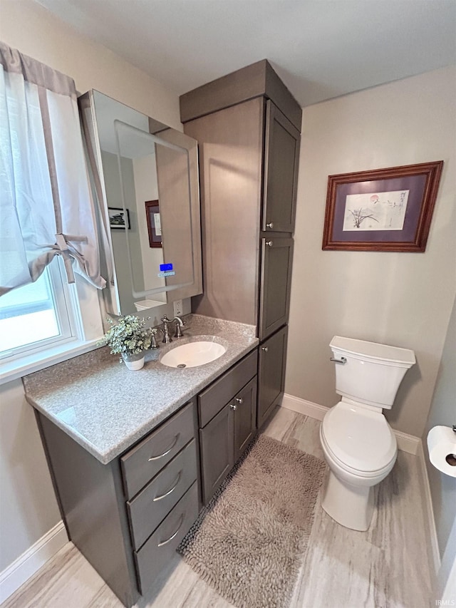 1500 N Grant St, West Lafayette, IN 47906 - half bath featuring toilet, vanity, and baseboards
