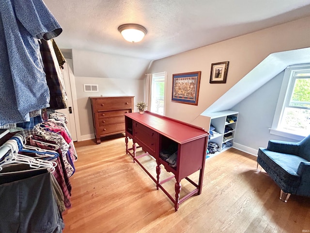 1500 N Grant St, West Lafayette, IN 47906 - home office featuring lofted ceiling, light wood-type flooring, baseboards, and a textured ceiling