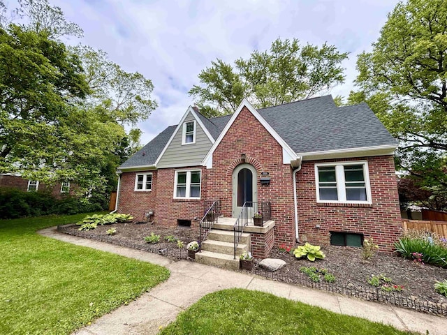 1500 N Grant St, West Lafayette, IN 47906 - tudor-style house featuring brick siding and roof with shingles
