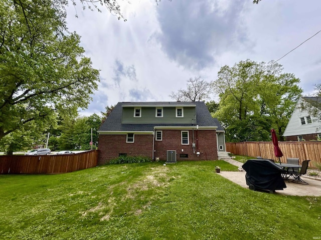 1500 N Grant St, West Lafayette, IN 47906 - rear view of property featuring a patio area, central AC, and brick siding