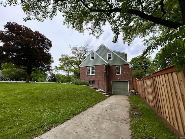 1500 N Grant St, West Lafayette, IN 47906 - view of side of property with brick siding, concrete driveway, and a garage