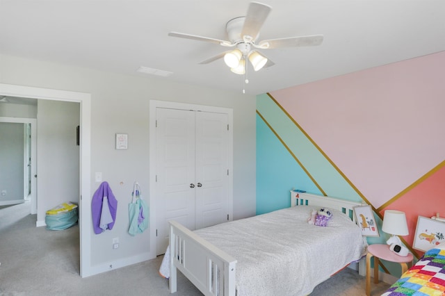 810 Tawny Dr, Evansville, IN 47712 - bedroom featuring a closet, light carpet, a ceiling fan, and baseboards