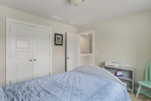 810 Tawny Dr, Evansville, IN 47712 - bedroom with light carpet, a closet, and baseboards
