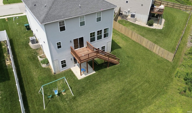 810 Tawny Dr, Evansville, IN 47712 - rear view of house with a deck, cooling unit, roof with shingles, and a patio area