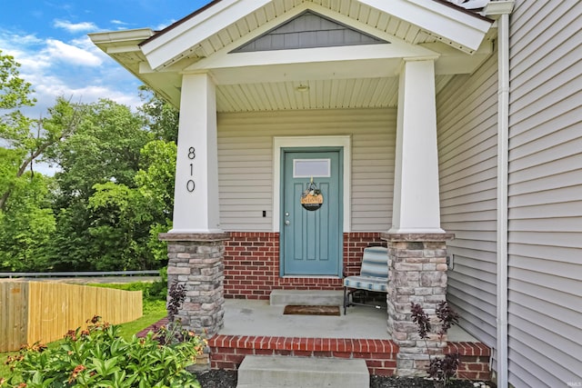 810 Tawny Dr, Evansville, IN 47712 - view of exterior entry featuring covered porch and brick siding