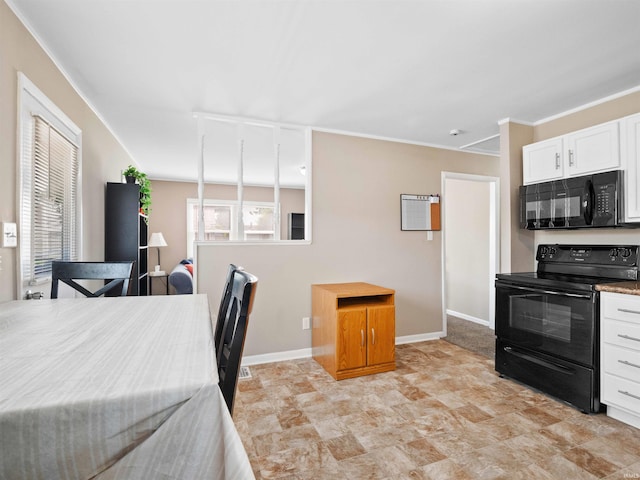 254 Forrest Ave, Wabash, IN 46992 - kitchen featuring black appliances, white cabinetry, baseboards, and stone finish flooring