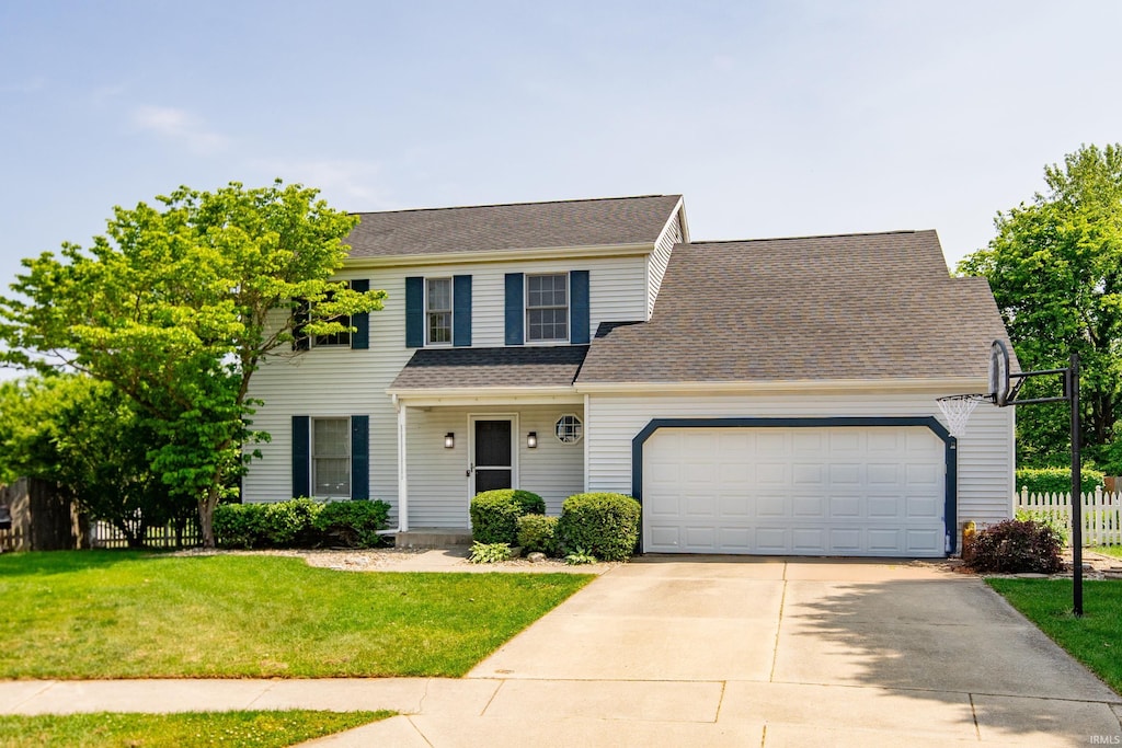 1718 Fawn Ct, South Bend, IN 46628 - view of front of property featuring a garage, concrete driveway, and roof with shingles