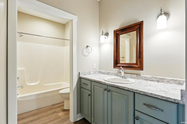 13769 Montoro Ct, Fort Wayne, IN 46845 - bathroom featuring toilet, vanity, wood finished floors, and bathing tub / shower combination