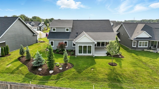 13769 Montoro Ct, Fort Wayne, IN 46845 - rear view of house featuring a yard, a residential view, and roof with shingles