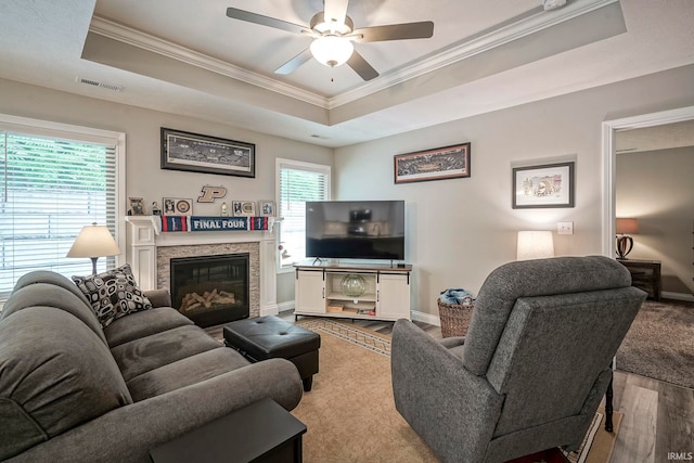 1757 Mill Pond Ln, Lafayette, IN 47905 - living area with a tray ceiling, wood finished floors, ornamental molding, a ceiling fan, and baseboards