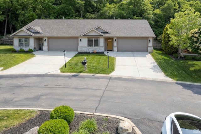 1757 Mill Pond Ln, Lafayette, IN 47905 - view of front facade with concrete driveway, a garage, a front yard, and roof with shingles