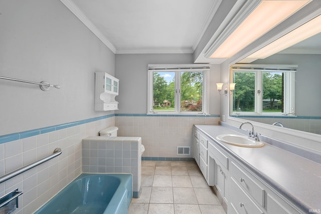 201 Colony Rd, West Lafayette, IN 47906 - full bathroom featuring tile walls, ornamental molding, a garden tub, vanity, and toilet